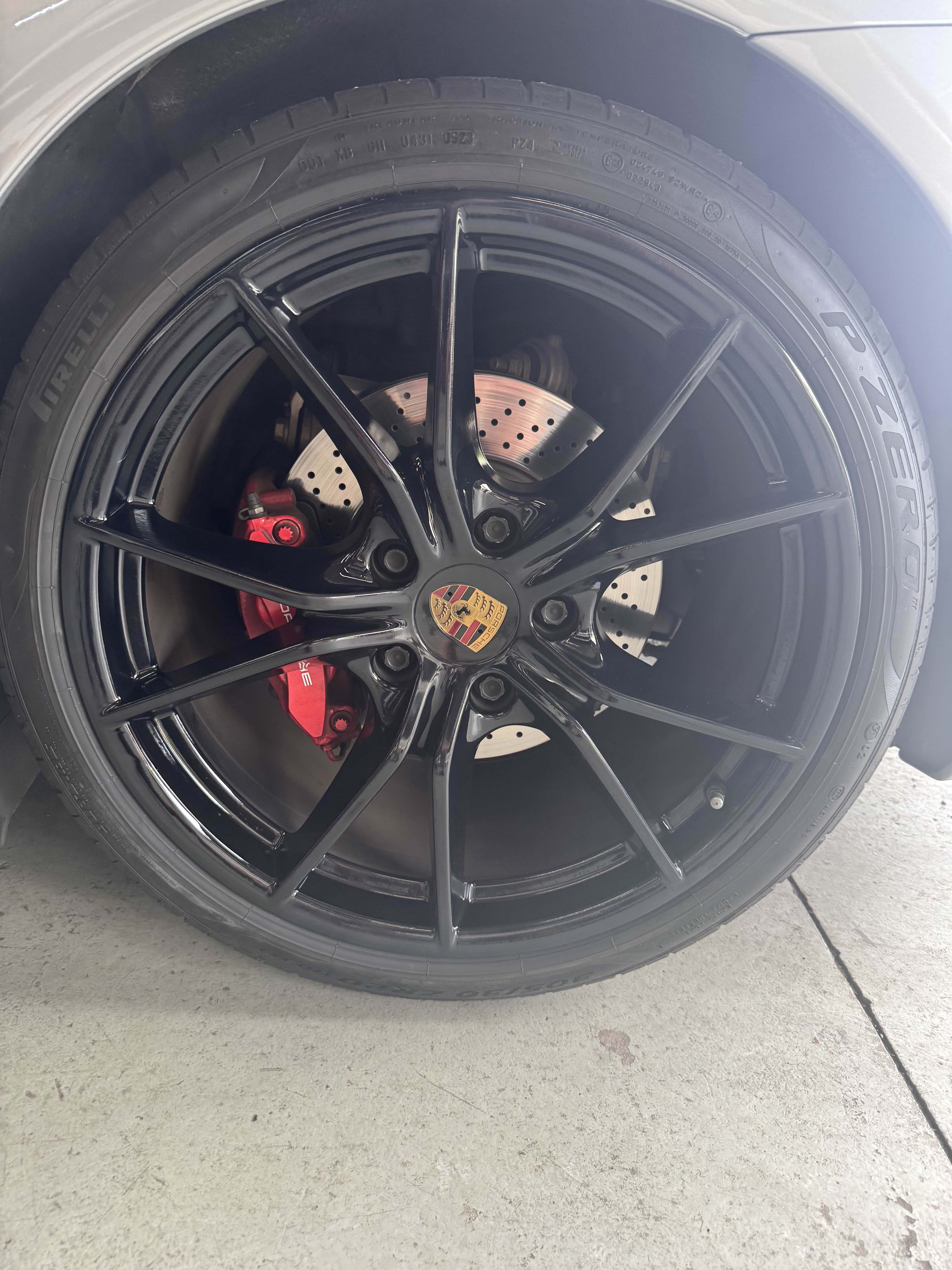 Repaired and clean black car wheel rim after detailing