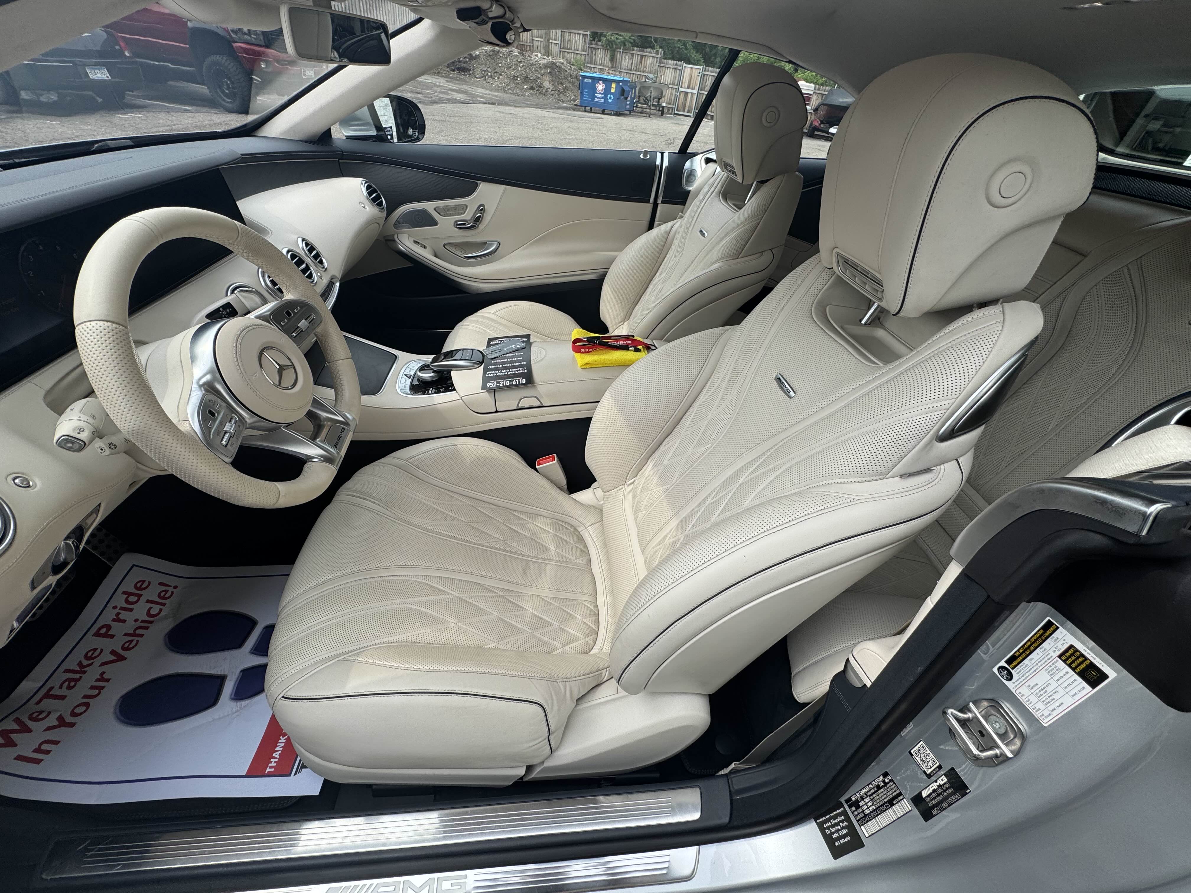 Clean white leather interior of a Mercedes-Benz after detailing