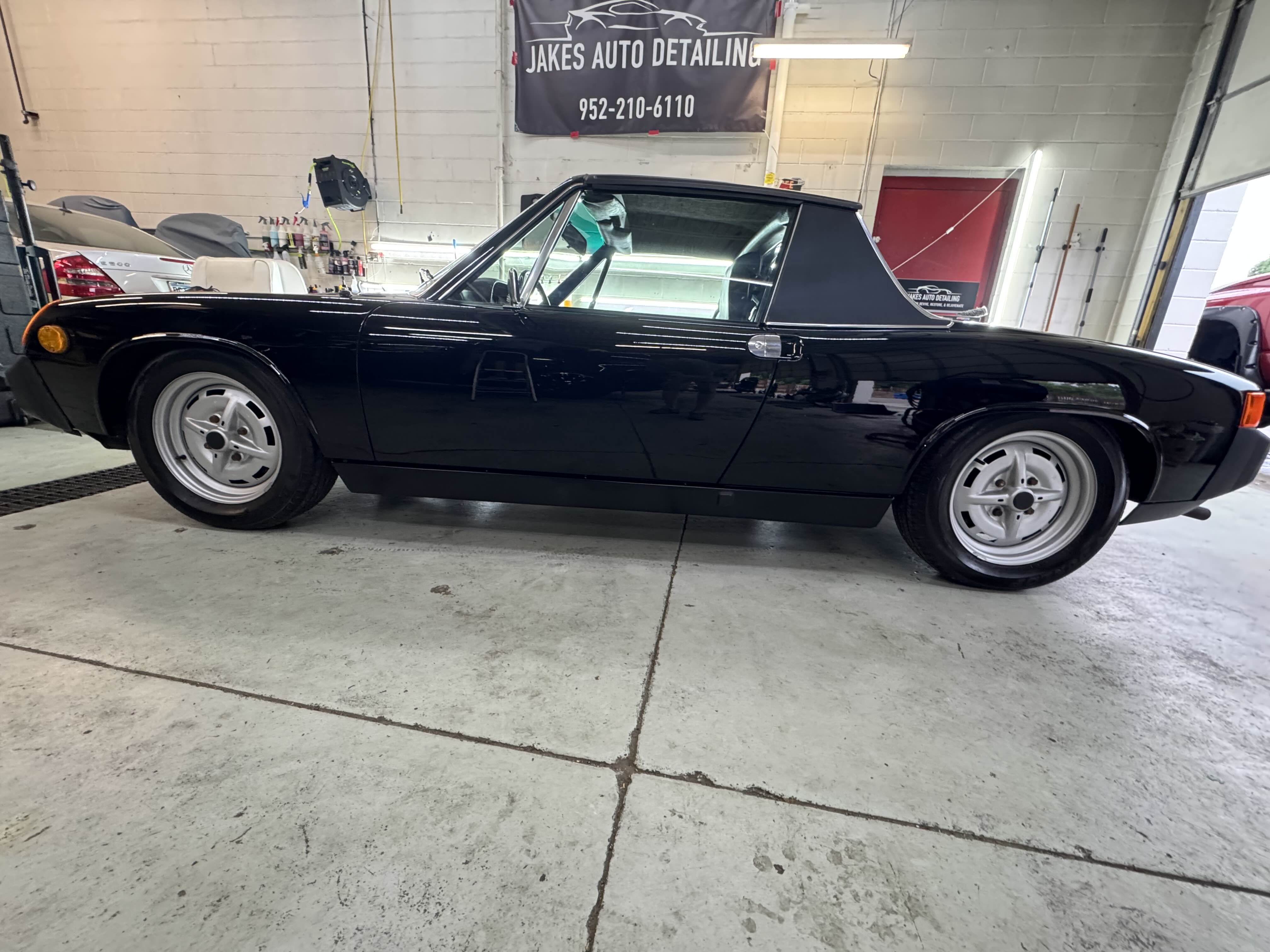Classic Porsche 914 side view in garage